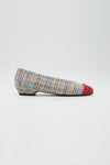 Ballerina mit buntem Tweed bezogen