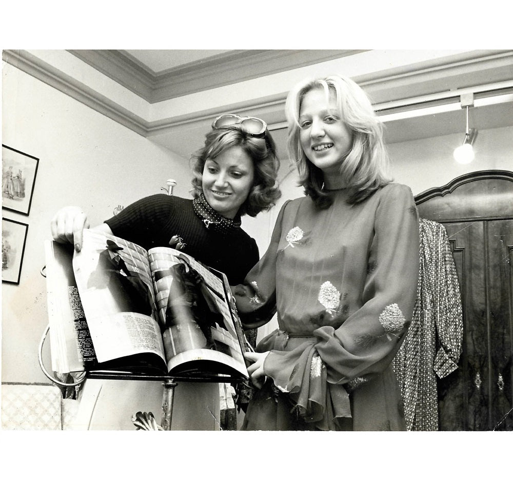 Couture/fashion designer Helga Okan, founder of PIO O'KAN, with model, 1975 after moving into her couture studio on Königsstraße in Düsseldorf.