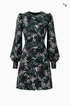 Ausgestelltes Kleid mit Gürtel und Statementärmeln aus Picqué