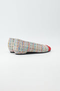 Ballerina mit buntem Tweed bezogen